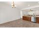 Open kitchen and dining area with stainless steel appliances and view of the backyard at 10758 E Peralta Canyon Dr, Gold Canyon, AZ 85118