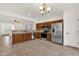 Open kitchen featuring stainless steel appliances, wood cabinets, and tile flooring at 10758 E Peralta Canyon Dr, Gold Canyon, AZ 85118