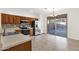 Kitchen features stainless steel appliances and a view of the backyard through sliding glass doors at 10758 E Peralta Canyon Dr, Gold Canyon, AZ 85118