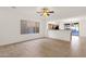 Open living room showcasing tile flooring and natural light, ideal for versatile furniture arrangements at 10758 E Peralta Canyon Dr, Gold Canyon, AZ 85118