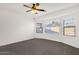 Spacious main bedroom with ceiling fan and large windows at 10758 E Peralta Canyon Dr, Gold Canyon, AZ 85118