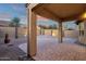 Covered patio with desert landscaping and beautiful sunset view at 10758 E Peralta Canyon Dr, Gold Canyon, AZ 85118