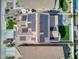 An aerial view shows solar panels on the roof, and a landscaped backyard with artificial grass at 10840 W Saddlehorn Rd, Peoria, AZ 85383