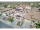 Aerial view of a home featuring a well manicured lawn, desert landscaping, solar panels, and a tile roof at 10840 W Saddlehorn Rd, Peoria, AZ 85383