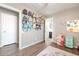 Bedroom featuring a collection of backpacks hanging on the wall, and wood laminate flooring at 10840 W Saddlehorn Rd, Peoria, AZ 85383