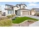 Two-story house with manicured lawn, desert landscaping, and a two-car garage at 10840 W Saddlehorn Rd, Peoria, AZ 85383