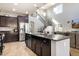 Gourmet kitchen island with stainless steel appliances, granite countertops and stairway access at 10840 W Saddlehorn Rd, Peoria, AZ 85383