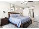 Spacious bedroom with a sliding barn door leading to the ensuite bathroom at 10840 W Saddlehorn Rd, Peoria, AZ 85383