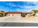 Charming single-story home featuring a three car garage and desert landscaping at 11056 E Nopal Ave, Mesa, AZ 85209