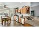 Well-lit kitchen featuring stainless steel appliances, granite countertops, and breakfast nook at 11056 E Nopal Ave, Mesa, AZ 85209