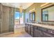 Bathroom featuring double vanity, standalone shower, and a standalone tub at 11656 N 135Th Pl, Scottsdale, AZ 85259