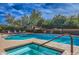 Relaxing pool area featuring a jacuzzi and beautiful landscaping, perfect for enjoying sunny days at 11656 N 135Th Pl, Scottsdale, AZ 85259