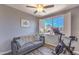 Cozy sitting room equipped with modern exercise equipment and a peaceful view through the window at 11656 N 135Th Pl, Scottsdale, AZ 85259