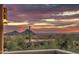 Sunset view from balcony of surrounding mountains and desert landscape at 11656 N 135Th Pl, Scottsdale, AZ 85259