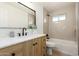 Bright bathroom features stylish vanity with marble countertop and a shower over tub combination at 1206 E Loyola Dr, Tempe, AZ 85282