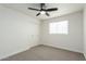 A spacious bedroom with closet and ceiling fan at 1206 E Loyola Dr, Tempe, AZ 85282