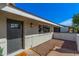 Stylish front entrance with modern door, updated light fixture and desert landscaping at 1206 E Loyola Dr, Tempe, AZ 85282