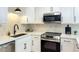 Beautiful kitchen detail highlighting modern appliances, countertops, stylish backsplash, and modern fixtures at 1206 E Loyola Dr, Tempe, AZ 85282