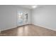 Bedroom featuring tiled floor, white walls, a ceiling fan and direct access to the backyard at 12601 S Tonto Ct, Phoenix, AZ 85044