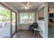 Cozy dining area featuring sliding glass doors, a ceiling fan and views of the backyard at 12601 S Tonto Ct, Phoenix, AZ 85044