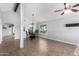 Bright dining room with a modern chandelier and tile flooring at 12601 S Tonto Ct, Phoenix, AZ 85044