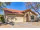 Charming single-story home featuring a terra cotta tile roof and a two-car garage at 12601 S Tonto Ct, Phoenix, AZ 85044