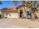 Charming single-story home featuring a terra cotta tile roof and a two-car garage at 12601 S Tonto Ct, Phoenix, AZ 85044