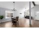 Spacious living room featuring tile floors, ample natural light and a ceiling fan at 12601 S Tonto Ct, Phoenix, AZ 85044