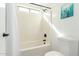 Clean bathroom featuring a shower and tub combination, along with an above-window to provide natural light at 13267 W Port Au Prince Ln, Surprise, AZ 85379