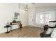 Well-lit living area featuring hardwood floors, modern decor, and a view of the front entrance at 13267 W Port Au Prince Ln, Surprise, AZ 85379