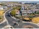 A high-angle view shows the community's winding streets, lush landscaping, and private pools, creating an upscale living environment at 139 E Desert Broom Dr, Chandler, AZ 85286