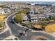 A high-angle view shows the community's winding streets, lush landscaping, and private pools, creating an upscale living environment at 139 E Desert Broom Dr, Chandler, AZ 85286