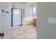 Bright bathroom featuring a glass-enclosed shower, separate tub, and tiled flooring with a clean design at 139 E Desert Broom Dr, Chandler, AZ 85286