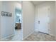 Entryway showcasing tile flooring, front door, and a view into an adjacent bathroom at 139 E Desert Broom Dr, Chandler, AZ 85286