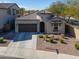 Inviting home with a two-car garage, tile roof, and well-maintained desert landscaping in a desirable neighborhood at 139 E Desert Broom Dr, Chandler, AZ 85286