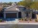 Charming single-Gathering home featuring a tile roof, two-car garage, and low-maintenance desert landscaping at 139 E Desert Broom Dr, Chandler, AZ 85286