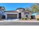 Charming single-story home with a well-manicured front yard and attached two-car garage and turret entry at 139 E Desert Broom Dr, Chandler, AZ 85286