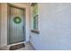 Inviting front entrance featuring a decorative wreath, a 'Welcome' mat, and light gray door at 139 E Desert Broom Dr, Chandler, AZ 85286