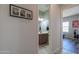 Hallway leading into a bathroom, with a glimpse of a bedroom visible through another doorway at 139 E Desert Broom Dr, Chandler, AZ 85286