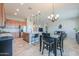 Open concept design connecting the kitchen, dining area, and living room with continuity of the tile flooring at 139 E Desert Broom Dr, Chandler, AZ 85286