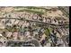 Overhead view of a neighborhood with numerous homes, golf course, and backyard swimming pools at 1431 S Nielson St, Gilbert, AZ 85296