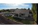 Aerial view of a backyard oasis with a sparkling pool, patio, and lush lawn at 1431 S Nielson St, Gilbert, AZ 85296