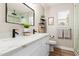 This bathroom features double sinks, a mirror, and a shower at 1431 S Nielson St, Gilbert, AZ 85296