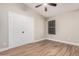 Cozy bedroom with neutral walls, ceiling fan, and closet with white doors at 1431 S Nielson St, Gilbert, AZ 85296