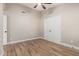 Bedroom featuring ceiling fan, neutral walls, and closet with double doors at 1431 S Nielson St, Gilbert, AZ 85296