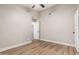 Bedroom featuring neutral walls, ceiling fan, and wood-style tile flooring at 1431 S Nielson St, Gilbert, AZ 85296