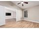 Open bedroom with neutral walls, ceiling fan, and wood-style tile flooring at 1431 S Nielson St, Gilbert, AZ 85296