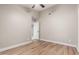 Bedroom with neutral walls, ceiling fan, and view to an adjacent room at 1431 S Nielson St, Gilbert, AZ 85296