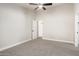 A nice, clean bedroom with gray carpet and ceiling fan at 1431 S Nielson St, Gilbert, AZ 85296