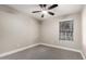 A comfortable bedroom featuring neutral color and ceiling fan at 1431 S Nielson St, Gilbert, AZ 85296